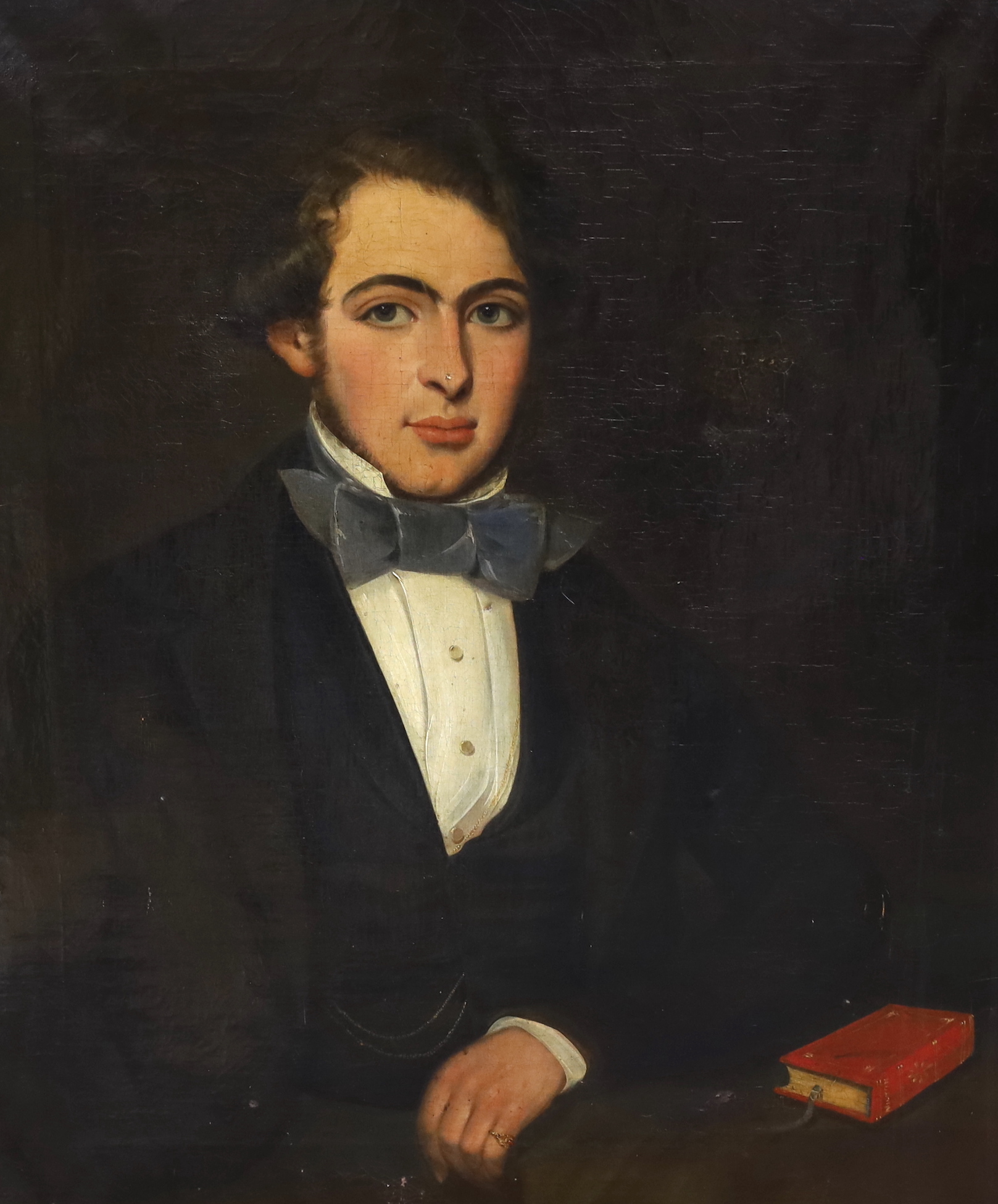 19th century Scottish School, oil on canvas, Portrait of a young gentleman seated with a John Milton book, partially indistinct ink inscription verso, ‘.... on his 19th birthday, 74 x 62cm, housed in a Victorian gilt fra